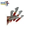 Hand holding small toy wrenches set.